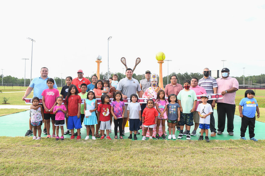 Pictured are Tribal Chief Cyrus Ben, 2019-2021 Choctaw Princess Elisah Jimmie, Choctaw Tribal Council Members, Tribal Recreation Staff, Construction Management Staff and members of the Tribal Community gather together for the Choctaw Sportsplex unveiling. 